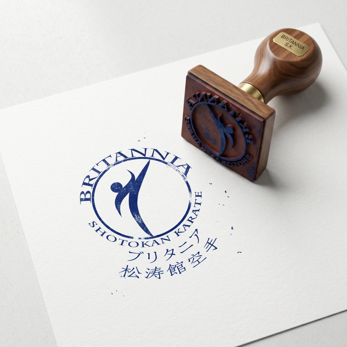 Luxury rubber stamp mockup for Britannia Shotokan Karate featuring minimalist logo design, premium martial arts branding, elegant visual identity, embossed stamp effect, and sophisticated corporate identity presentation