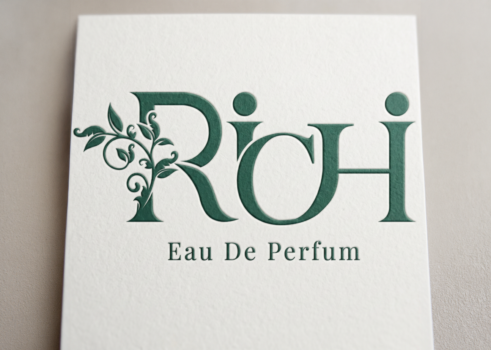 Elegant logo design and visual identity mockup for Richi, featuring sophisticated green embossed typography on premium textured paper, representing timeless luxury branding and minimalist corporate identity.